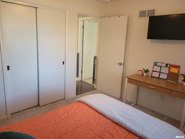 bedroom with a closet and carpet