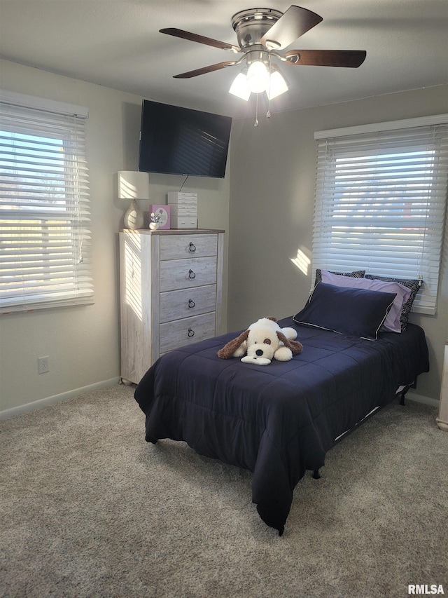 carpeted bedroom featuring ceiling fan