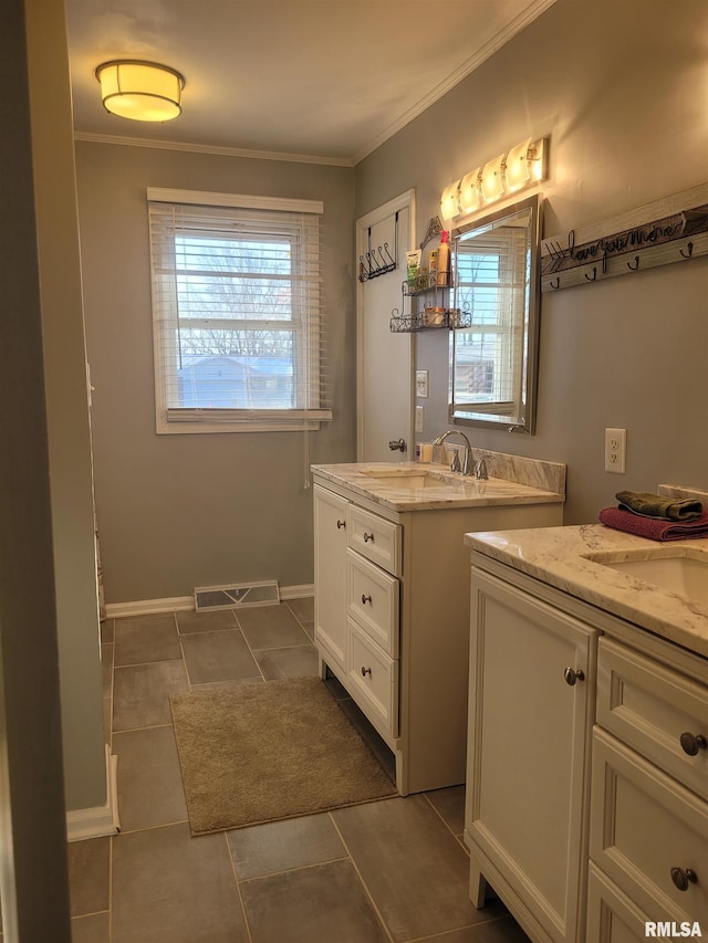full bath with a sink, visible vents, two vanities, and tile patterned flooring