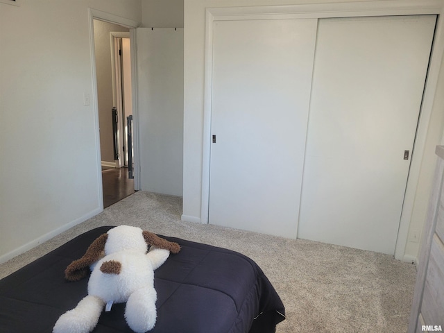 bedroom with a closet and carpet