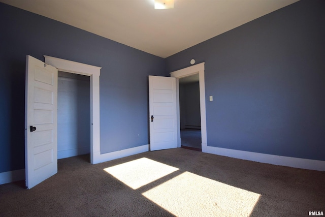 unfurnished bedroom with dark carpet