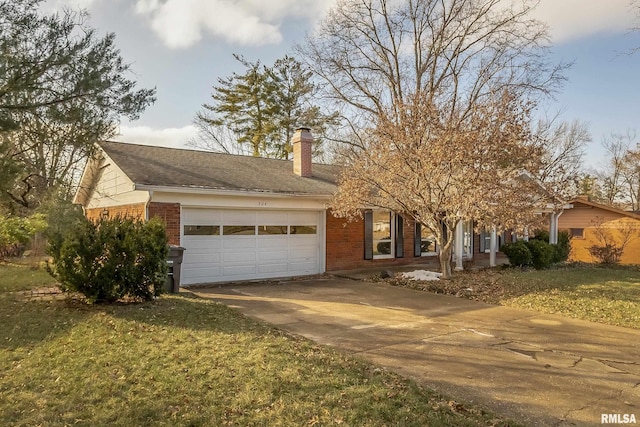 view of front of property featuring a garage and a front yard