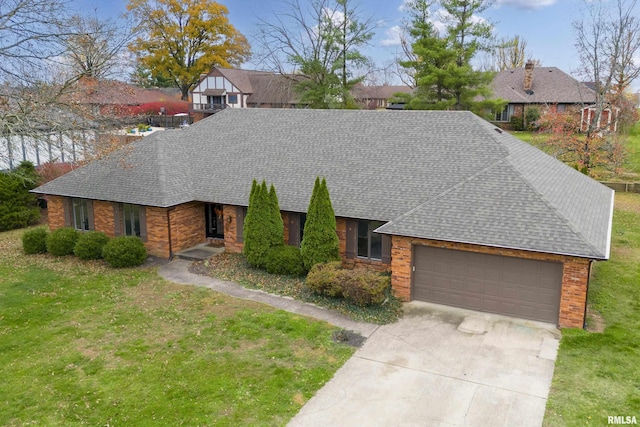 ranch-style house featuring a garage and a front lawn