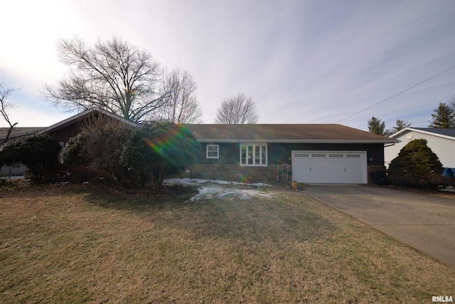 ranch-style home with a garage and a front lawn