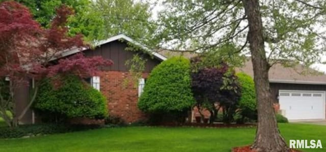 view of property exterior with a yard and a garage