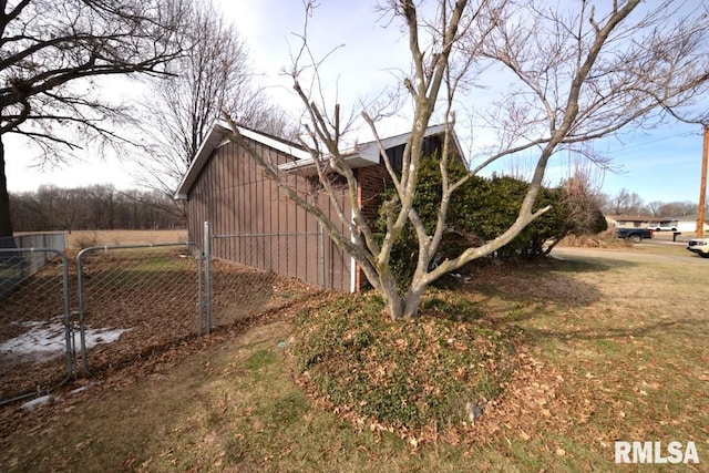 view of property exterior featuring a yard