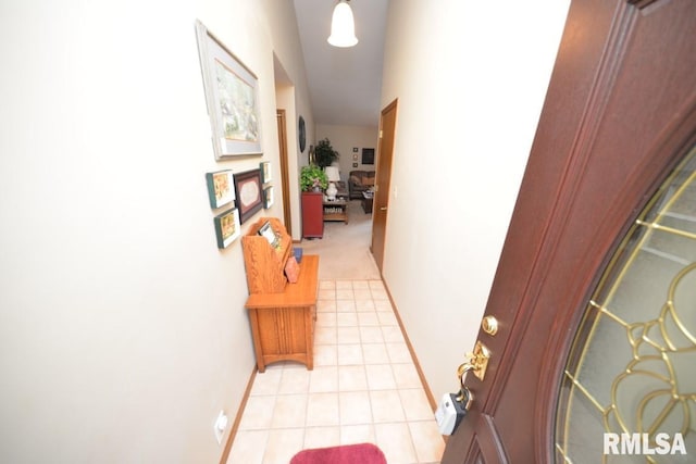 hallway featuring light tile patterned flooring