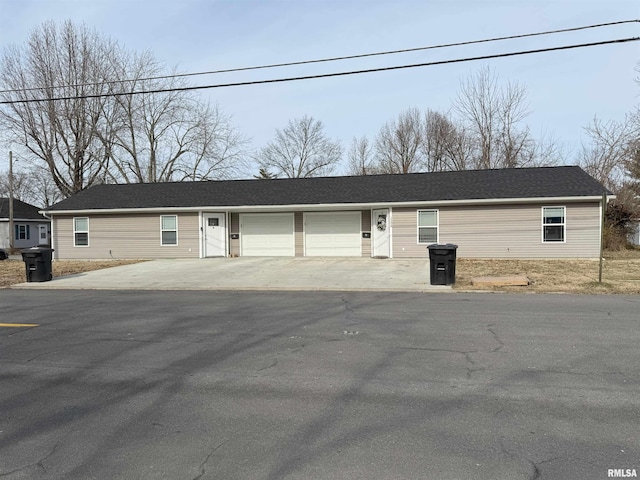 single story home with a garage