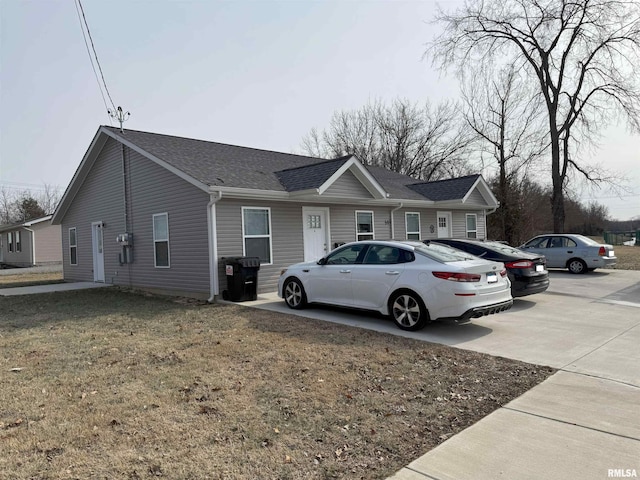 view of property exterior with a yard