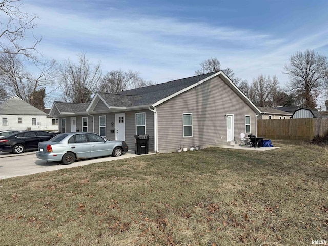 view of property exterior featuring a lawn