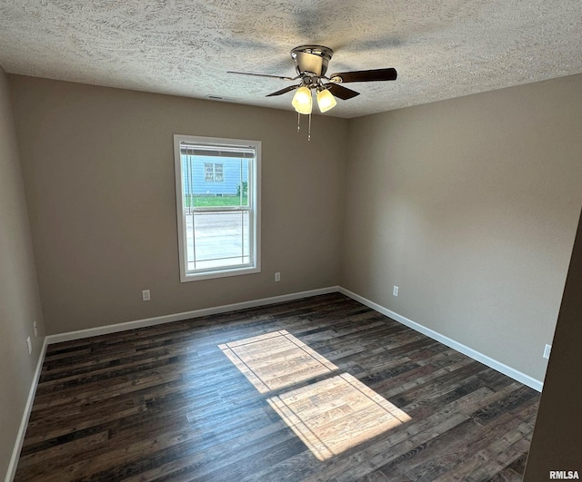 spare room featuring ceiling fan, a textured ceiling, and dark hardwood / wood-style flooring