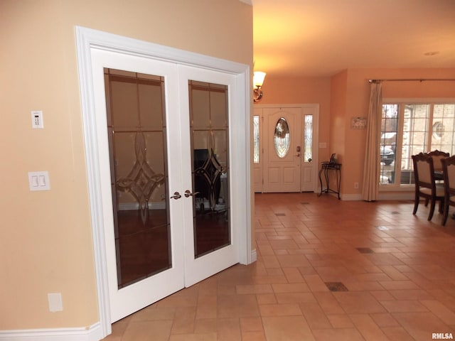 foyer entrance featuring french doors