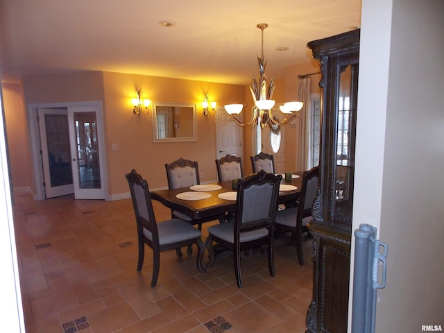 dining space featuring an inviting chandelier