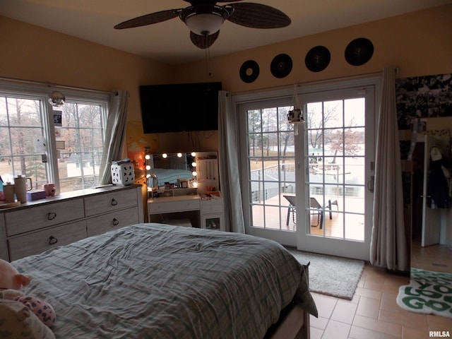 tiled bedroom with ceiling fan