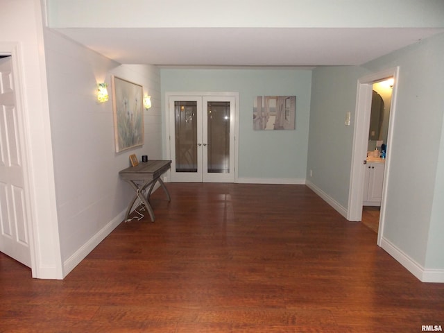 corridor featuring dark hardwood / wood-style floors and french doors