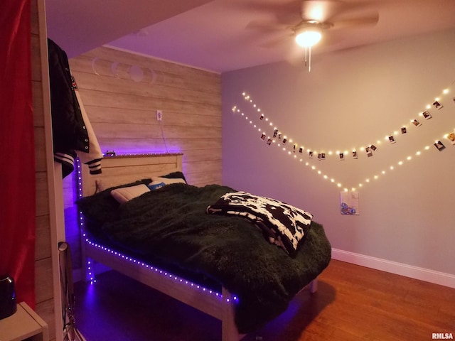 bedroom featuring hardwood / wood-style floors and ceiling fan