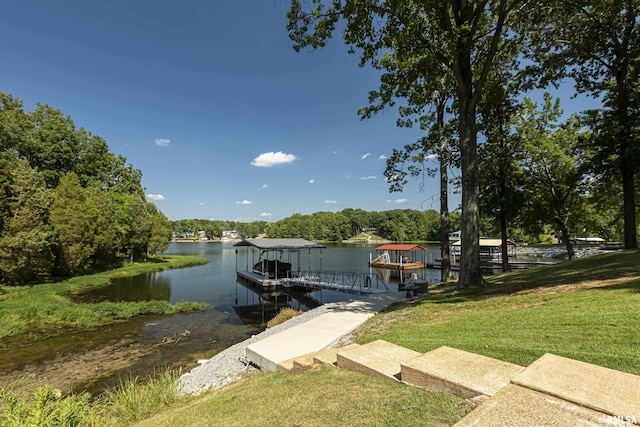 dock area featuring a water view and a yard