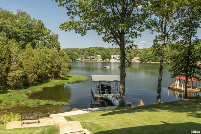 view of dock featuring a water view and a lawn