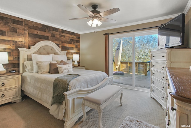 bedroom featuring ceiling fan, wooden walls, ornamental molding, access to outside, and light colored carpet