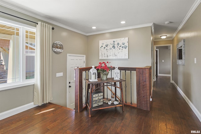 entryway with ornamental molding and dark hardwood / wood-style flooring