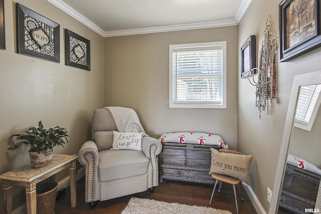 living area featuring dark hardwood / wood-style flooring and ornamental molding