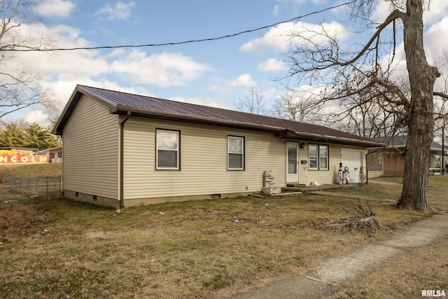 view of front facade with a garage and a front lawn