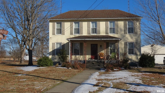 view of front of house featuring a garage and a porch