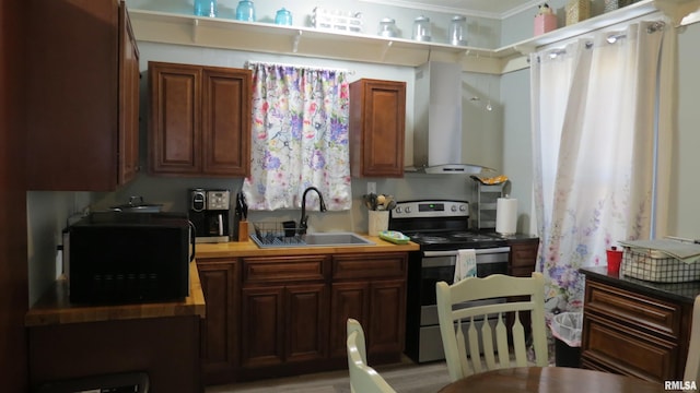 kitchen featuring electric stove, ornamental molding, sink, and wall chimney range hood