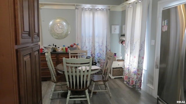 dining area with wood-type flooring