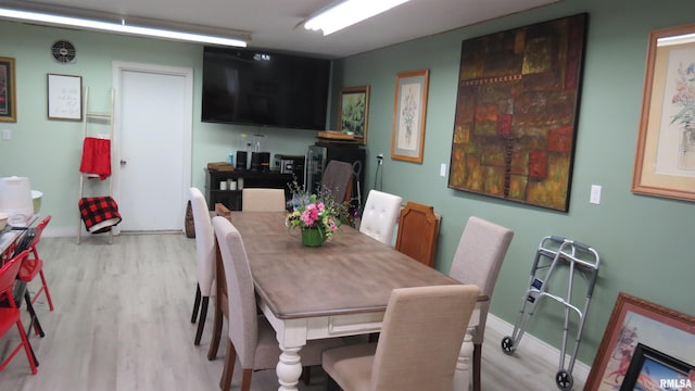 dining space with light hardwood / wood-style flooring