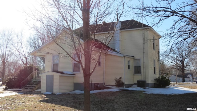 view of side of home featuring cooling unit