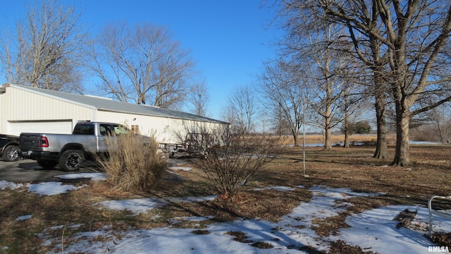 exterior space featuring a garage and an outdoor structure