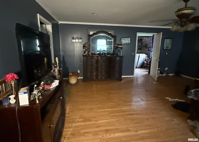 hallway with crown molding, washer and clothes dryer, and light hardwood / wood-style floors