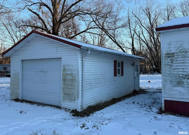 view of snow covered garage