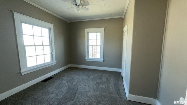 carpeted spare room with ornamental molding and ceiling fan