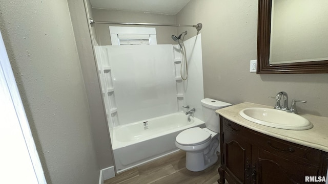 full bathroom featuring wood-type flooring, toilet, shower / bath combination, and vanity