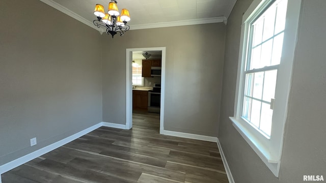 unfurnished dining area featuring ornamental molding, plenty of natural light, and dark wood-type flooring