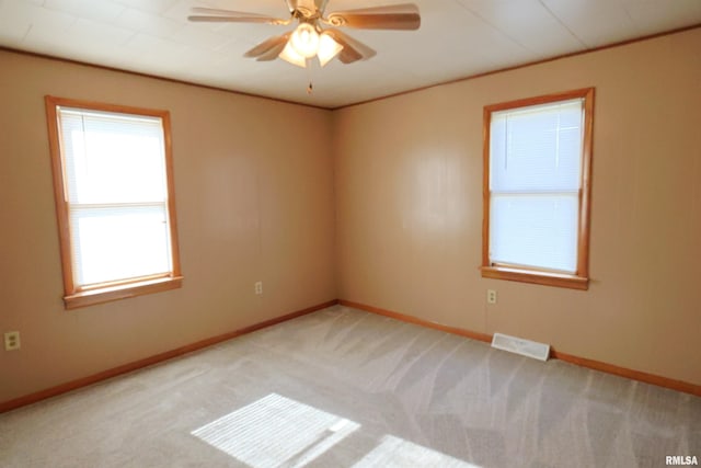 carpeted empty room with ceiling fan