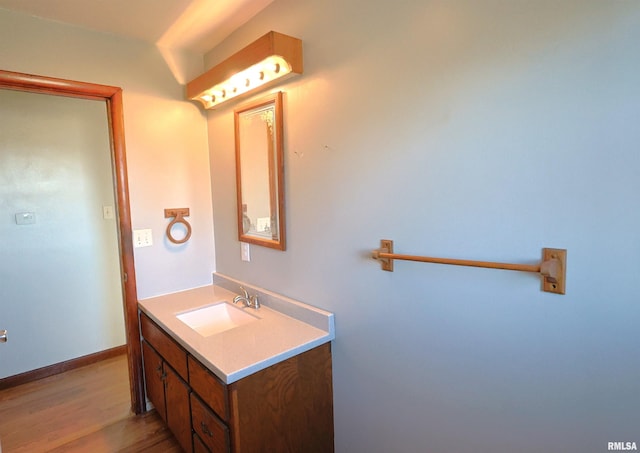 bathroom featuring vanity and hardwood / wood-style floors