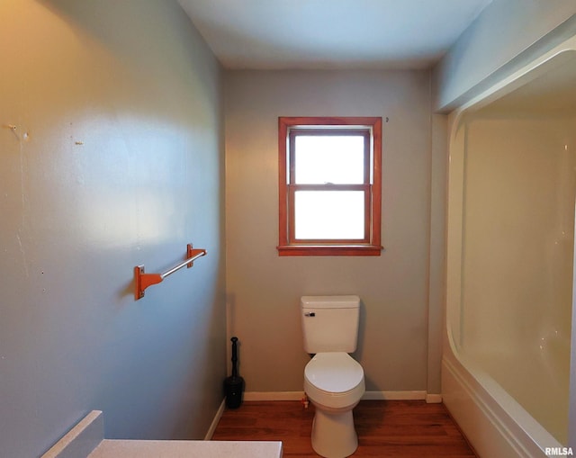 bathroom featuring wood-type flooring and toilet