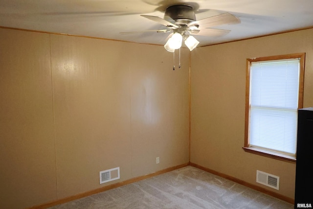 carpeted empty room with ceiling fan