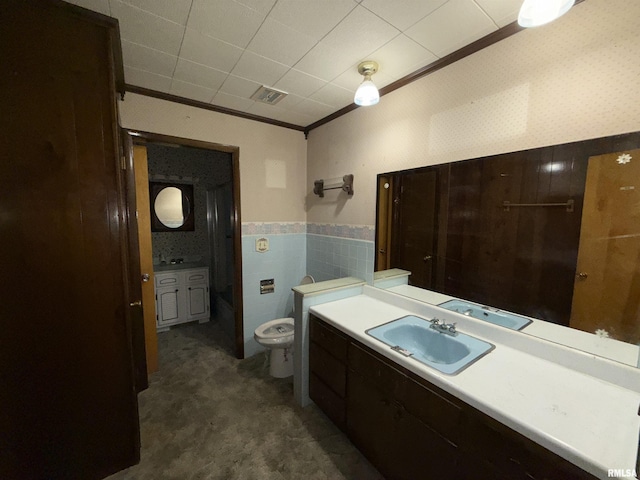 1117 E Ash St, Herrin, IL 62948 - bathroom featuring ornamental molding, vanity, toilet, a wainscoted wall, and tile walls