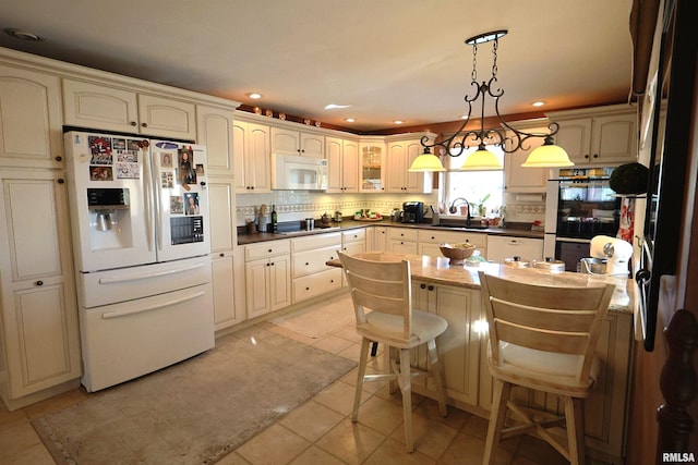205 E Jennings, Salem, IL 62881 - kitchen featuring white appliances, dark countertops, decorative backsplash, pendant lighting, and light tile patterned floors