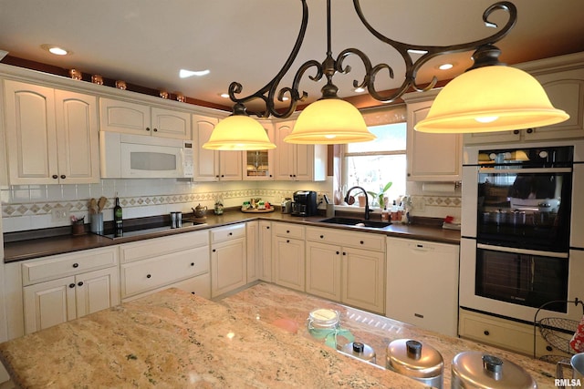 205 E Jennings, Salem, IL 62881 - kitchen featuring white appliances, a sink, tasteful backsplash, and decorative light fixtures