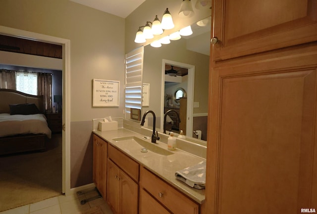 bathroom featuring tile patterned flooring and vanity