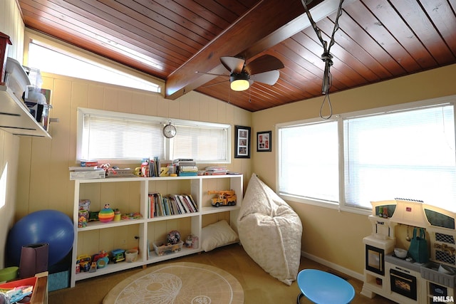 rec room with ceiling fan, vaulted ceiling with beams, and wood ceiling