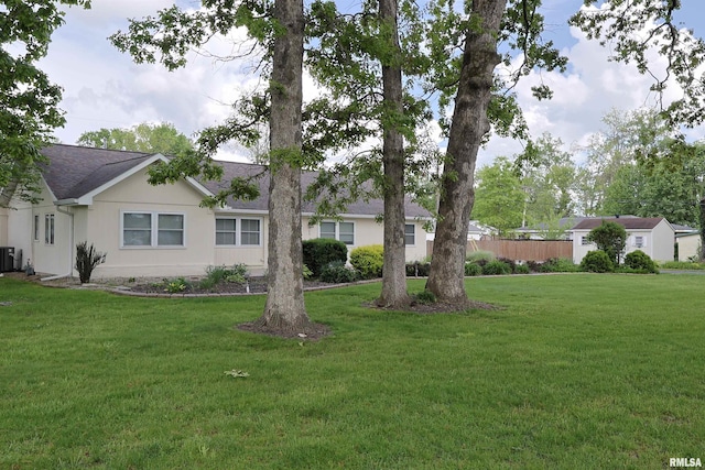 205 E Jennings, Salem, IL 62881 - view of front facade with central AC unit, roof with shingles, and stucco siding
