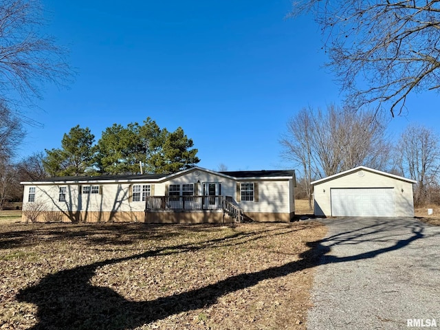 view of front facade featuring an outbuilding and a garage