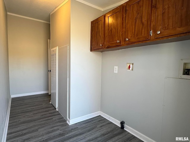 clothes washing area with cabinets, hookup for a washing machine, ornamental molding, and dark hardwood / wood-style floors