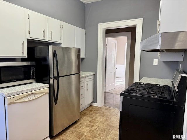 kitchen featuring light countertops, appliances with stainless steel finishes, white cabinetry, and under cabinet range hood